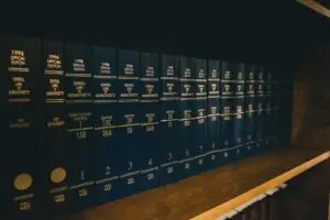 blue law books on brown wooden shelf