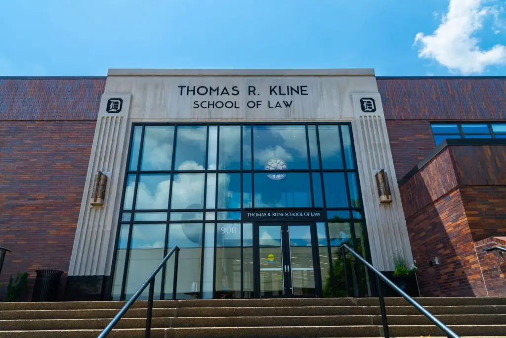 Front view of Thomas R. Kline School of Law building on a sunny day with a clear sky.